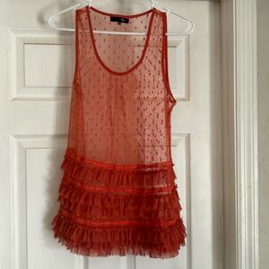 Orange see through top.